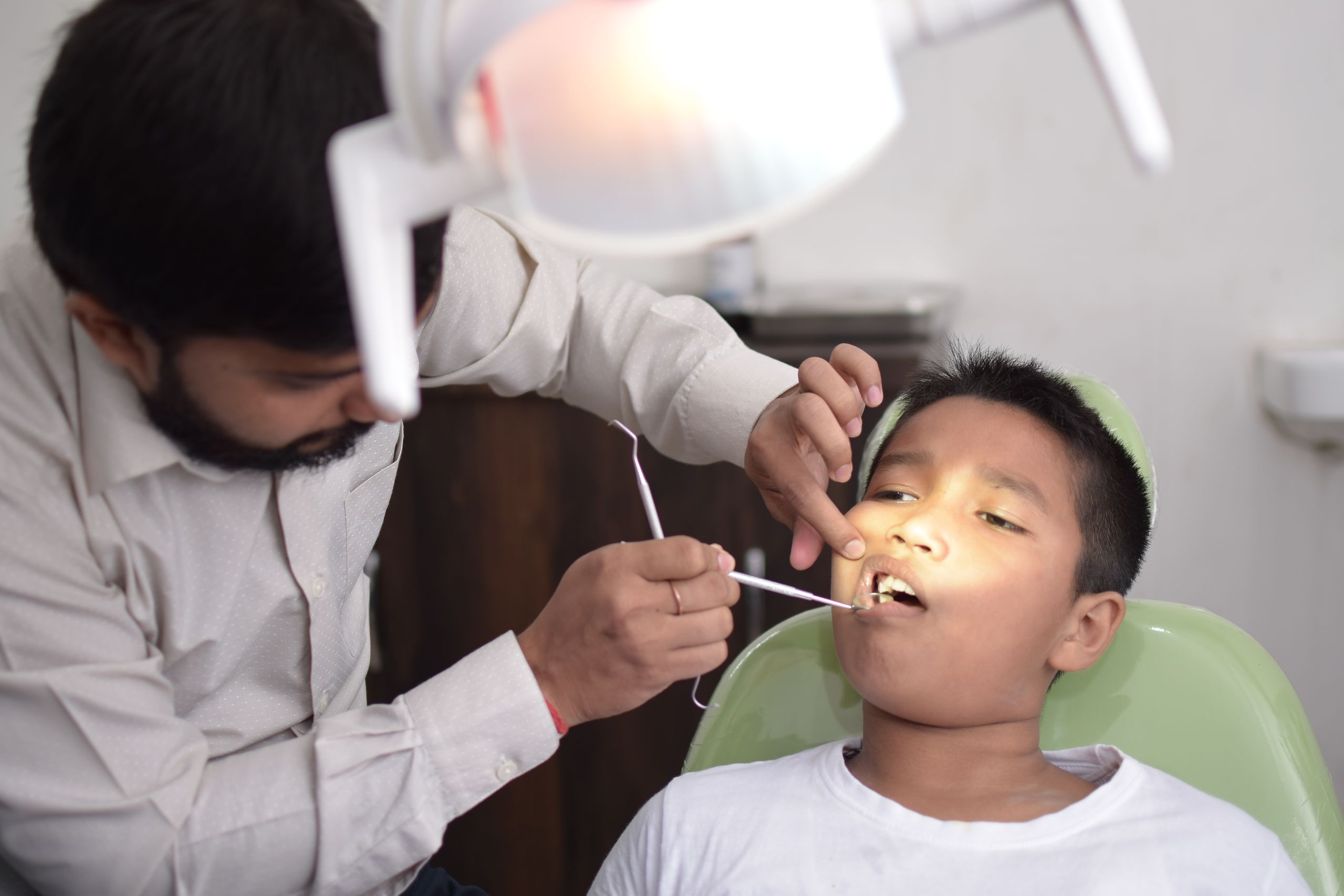 Dentist with young patient